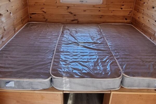 Pod kingsize bed using insert and third mattress.