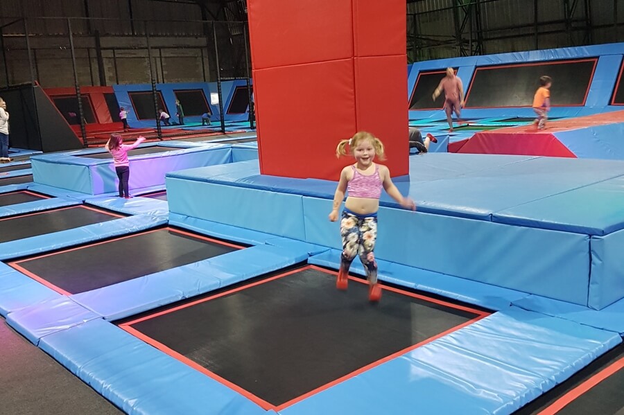 Girl jumping on a trampoline at Fusion Trampoline Park