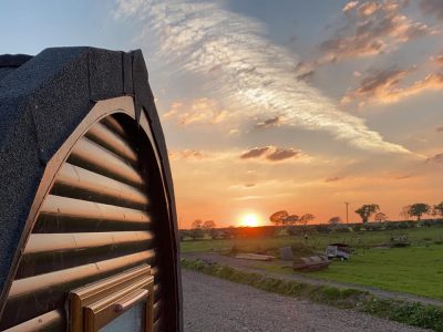 The sunsetting over the camping pod