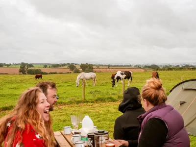 People laughing in the camping paddock