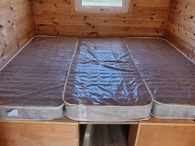 Pod kingsize bed using insert and third mattress.