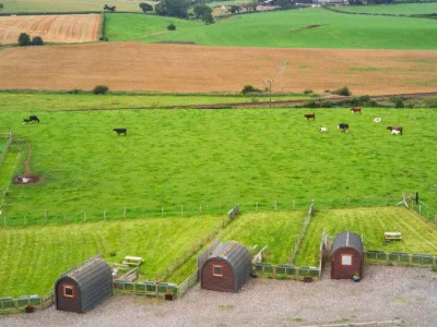 Pods surrounded by farmland and mountains